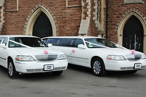 White Limos at the church on time!